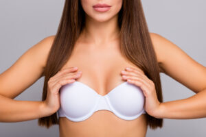Close-up of a woman's torso post breast lift surgery, illustrating the natural uplift and shape without implants.
