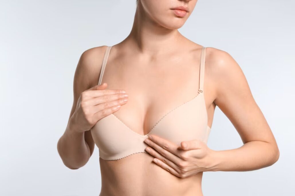 Woman in a bra, indicating breast lift candidacy due to sagging and loss of volume.